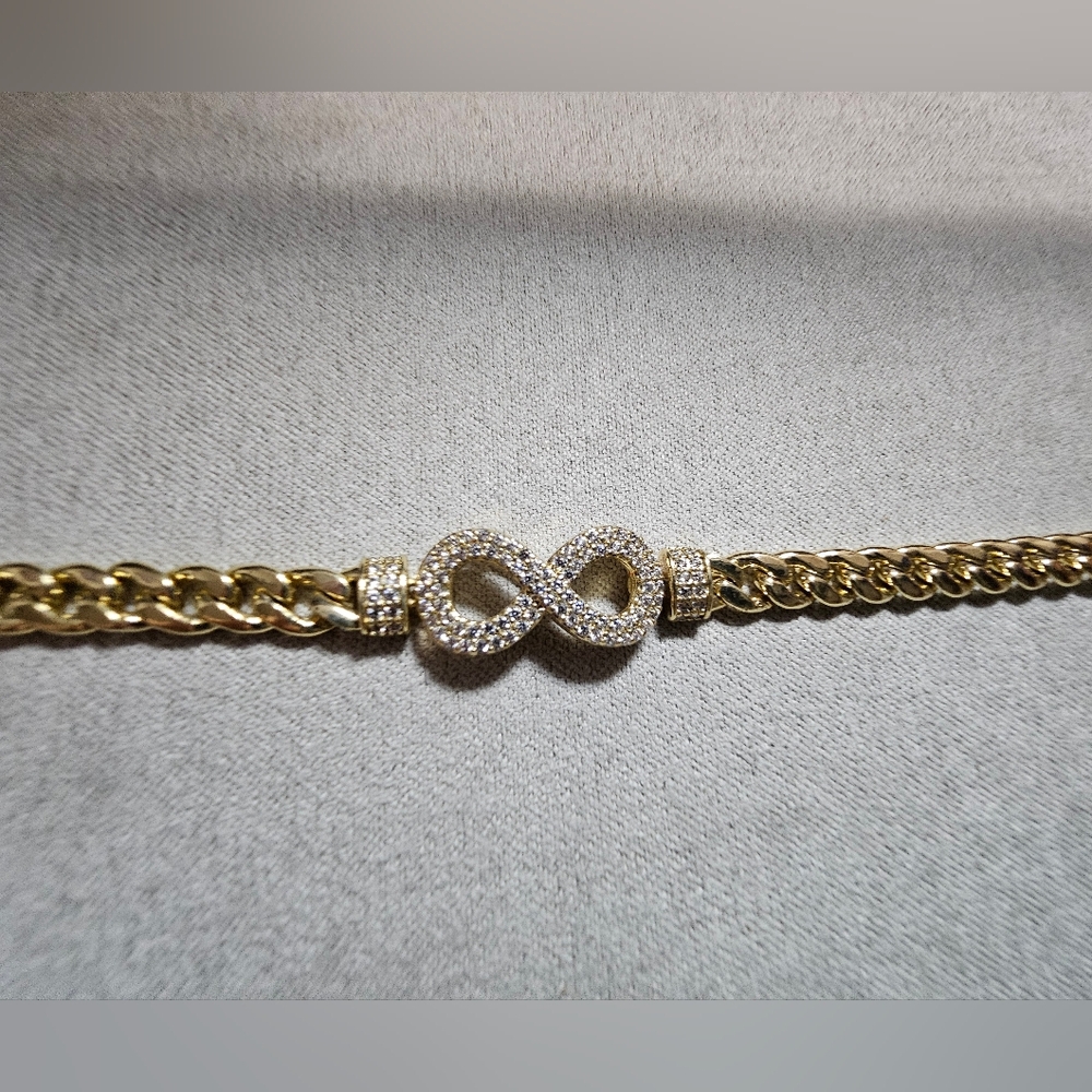 Dazzling Gold Tone Infinity Bracelet with Crystals